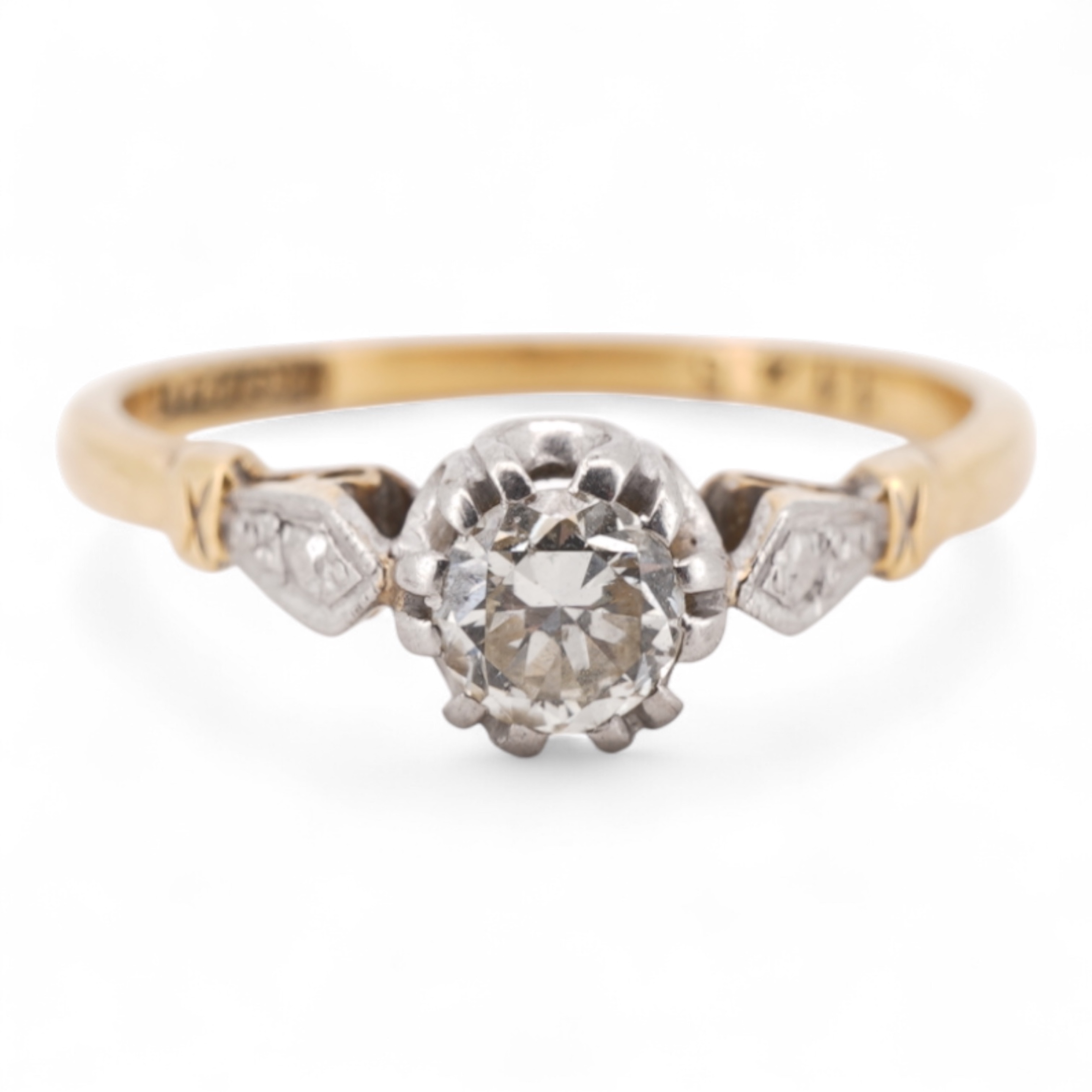 A diamond ring, set with a brilliant-cut diamond weighing approximately 0.20 carats, mounted in gold and platinum, size O1/2, stamped 18CT PLAT, gross weight approximately 2 grams, Condition: good, minor wear, diamond es